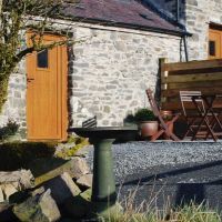 Private patio at The Stables, with garden furniture